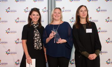 Claire Hands with her Our Health Heroes award